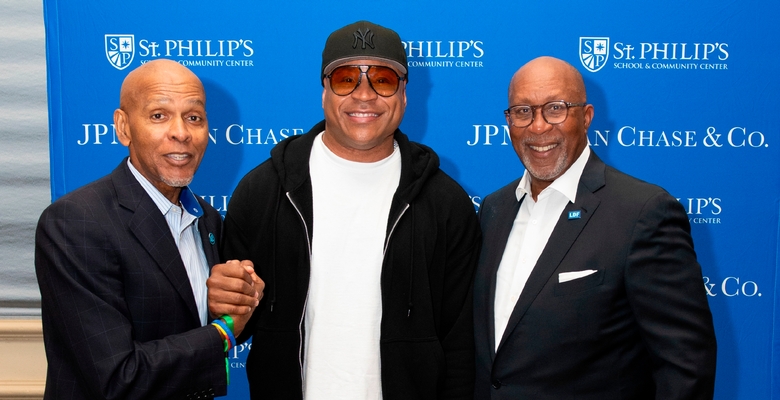 Roland Parrish, LL COOL J and Ron Kirk pose for a photo.
