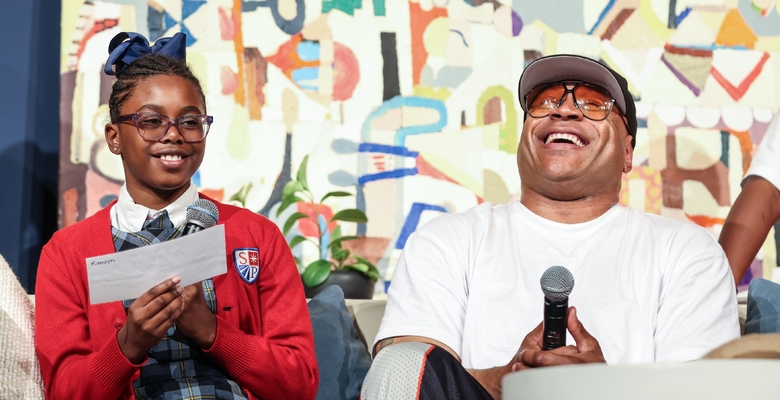 Student shares a laugh with LL COOL J.